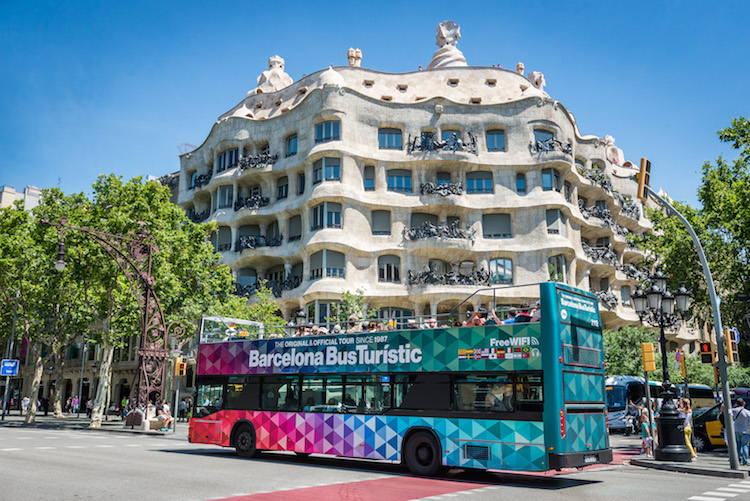 Barcelona hop-on hop-off bus in front of La Pedrera.